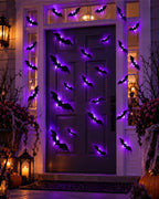 Front door decorated with glowing bats
